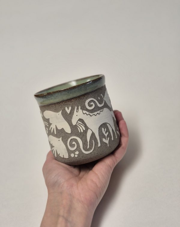 Ceramic sgraffito mug with horses