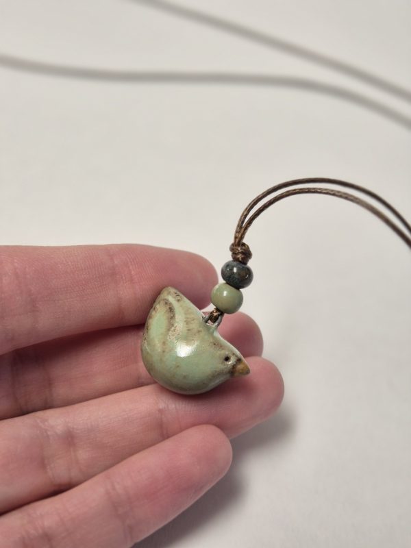 Tiny bird pendant